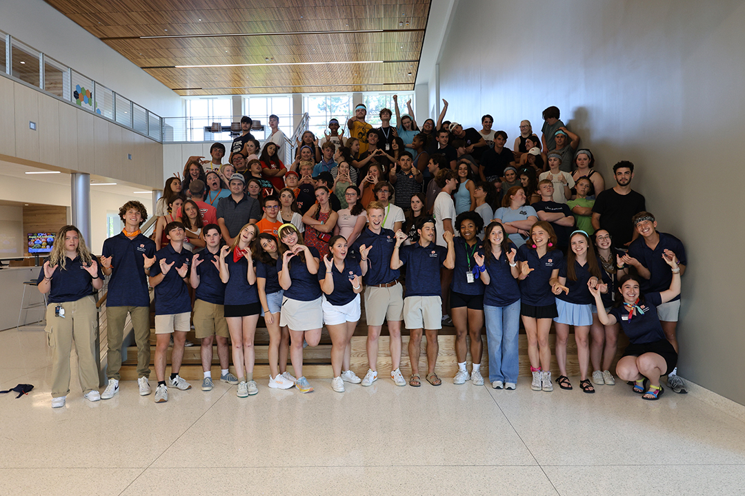 all participants are in a group photo acting silly 